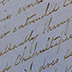 Detail of manuscript on 19th-century blue paper, often found in archival collections.