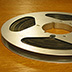 This audio tape reel has developed mold on the edges of the tape due to high relative humidity.