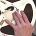 When reels are held up to light, acetate tape is translucent while polyester tape is opaque.