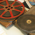 Motion picture film reels and original boxes.