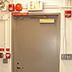 This stacks door shows automatic and manual fire measures. The manual fire extinguisher, though easily accessible, should be mounted on the wall.